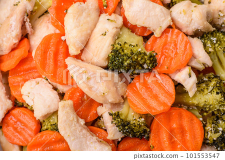 Delicious dish consisting of pieces of boiled chicken, broccoli and carrots 101553547