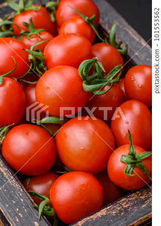 Fresh red cherry tomatoes in a wooden vintage box 101553562