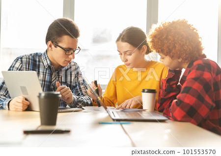 Focused female team leader discuss financial statistics brainstorming business meeting with partners clients at office. Lady boss leader young businesswoman. Diverse corporate professional team 101553570