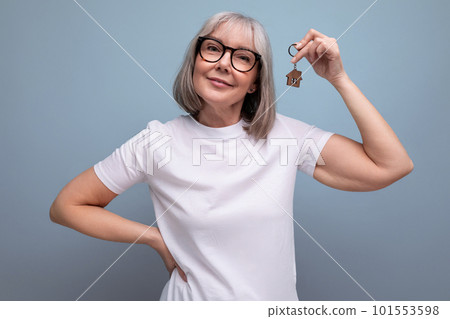 middle-aged turnkey business. woman holding real estate keys middle-aged turnkey business. woman holding real estate keys 101553598