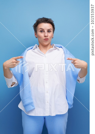 portrait of charismatic young millennial woman with short haircut pointing finger portrait of charismatic young millennial woman with short haircut pointing finger 101553937