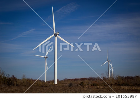 Wind turbines against blue sky background. Wind turbines against blue sky background. 101553987