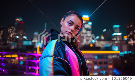A woman standing in front of a city skyline at night. AI generative image 101556049