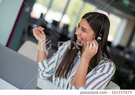 Brunette Lady Video Calling On Laptop Wearing Headphones Smiling And Waving Hand To Webcam Communicating Online 101557073