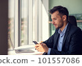 Young businessman talking on the phone at the office 101557086