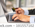 Woman working at home office hand on keyboard close up 101557102