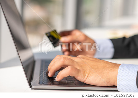 Woman working at home office hand on keyboard close up 101557102