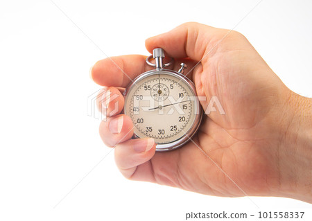 hand with a mechanical analog stopwatch on a white background 101558337