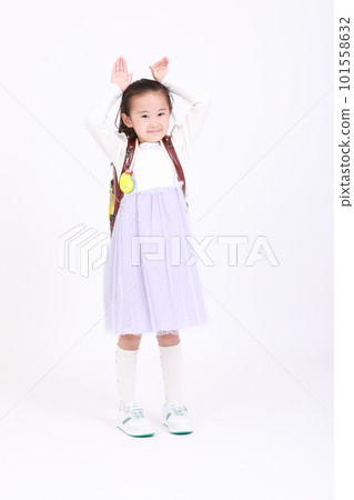 A girl in a school bag with various poses A girl in a school bag with various poses 101558632