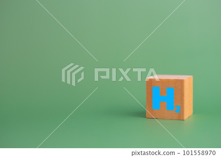 wood cube block h2 hydrogen on table. 101558970