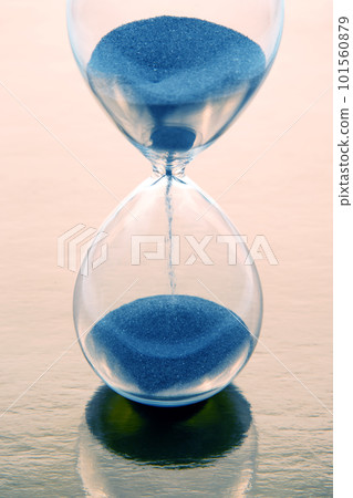 hourglass on a golden background. time and minute measurement hourglass on a golden background. time and minute measurement 101560879