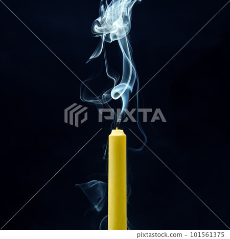 Smoke from an extinguished candle on a dark background. Smoke from an extinguished candle on a dark background. 101561375