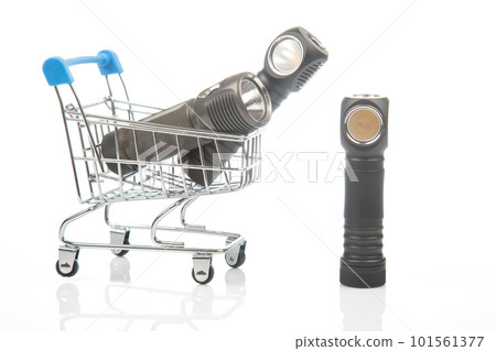 different flashlight in a grocery basket on a white background 101561377