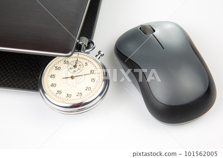 Stopwatch and laptop with a mouse on a white background. Time control for work and games online 101562005