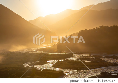 Sunlight in the mountains against the backdrop of a mountain river in Georgia. 101562037