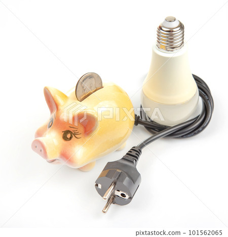 Piggy bank, LED lamp and electric cable plug. Saving electricity. Energy saving concept 101562065