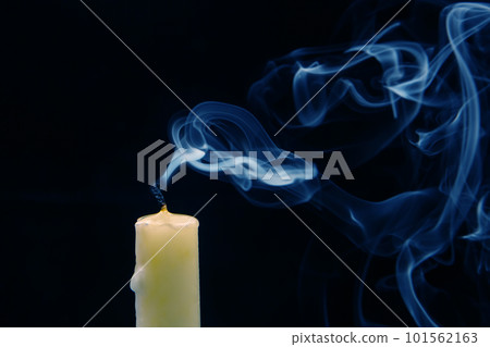 Smoke from an extinguished candle on a dark background. Smoke from an extinguished candle on a dark background. 101562163