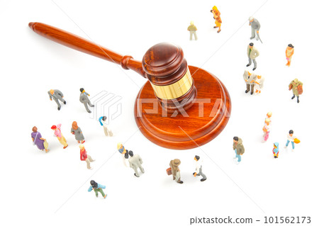 Miniature people. Many people near the gavel of law and justice Miniature people. Many people near the gavel of law and justice 101562173