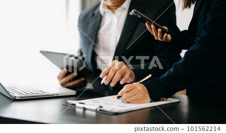 Business team meeting present.professional investor working with Finance managers task. with digital tablet,smartphone and laptop at office Business team meeting present.professional investor working with Finance managers task. with digital tablet,smartphone and laptop at office 101562214