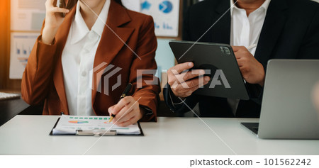 Businessman and team analyzing financial statement Finance task. with smart phone and laptop and tablet. Wealth management concept. Businessman and team analyzing financial statement Finance task. with smart phone and laptop and tablet. Wealth management concept. 101562242
