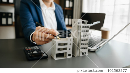 Considering buying a home, investing in real estate. Broker signs a sales agreement. agent, lease agreement, successful deal . Considering buying a home, investing in real estate. Broker signs a sales agreement. agent, lease agreement, successful deal . 101562277