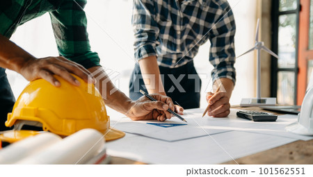 Close up of business people having consultation about wind energy at company office. Asian industry professional team in sun light Close up of business people having consultation about wind energy at company office. Asian industry professional team in sun light 101562551