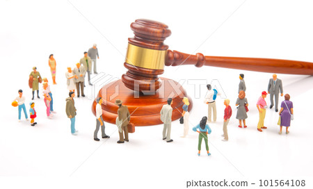 Miniature people. Many people near the gavel of law and justice. 101564108