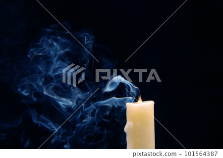 Smoke from an extinguished candle on a dark background. Smoke from an extinguished candle on a dark background. 101564387