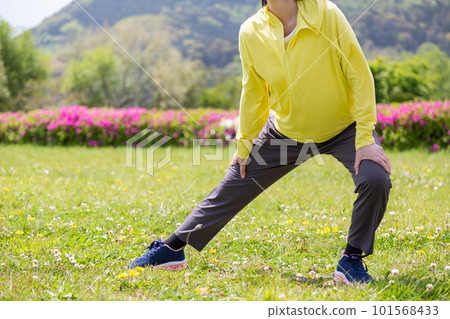 Senior woman stretching her legs in the park Senior woman stretching her legs in the park 101568433