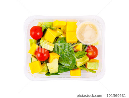 Fresh salad of avocado, mango, spinach and cherry tomatoes in a plastic container on a white background. 101569681