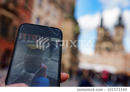 Traditional Tasty Baked Trdelnik in Czech Republic, Tyn Church on the Background 101571349