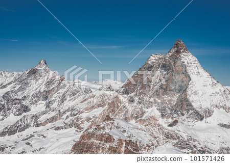 Scenic sunrise or sunset view of Matterhorn - one of the most famous and iconic Swiss mountains, Zermatt, Valais, Switzerland 101571426