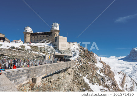 Observatory and hotel on Mount Gornergrat. Landscape of the hotel building and the Matterhorn mountains. Zermatt, Switzerland. Observatory and hotel on Mount Gornergrat. Landscape of the hotel building and the Matterhorn mountains. Zermatt, Switzerland. 101571450