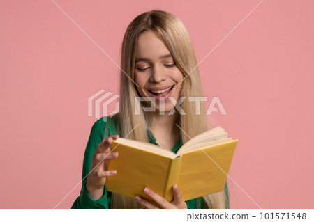 Woman reading funny interesting fairytale story book, leisure hobby knowledge wisdom learning, study Woman reading funny interesting fairytale story book, leisure hobby knowledge wisdom learning, study 101571548