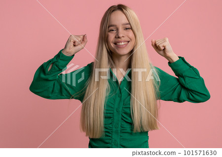 Happy young woman celebrating success, winning, birthday, lottery jackpot goal achievemen, good news 101571630