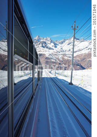 The train of Gonergratbahn running to the Gornergrat station and Stellarium Observatory - famous touristic place with clear view to Matterhorn. Glacier Express train. 101571848