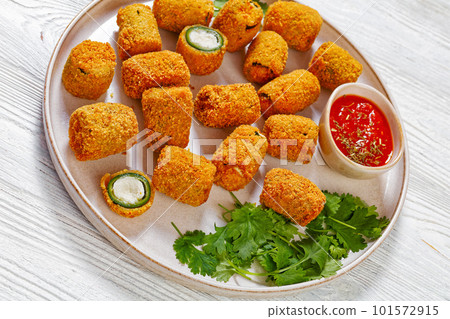 breaded crispy fried jalapeno poppers, top view 101572915