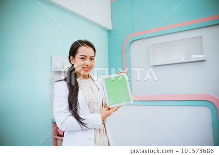 female vet showing tablet on her hand female vet showing tablet on her hand 101573686