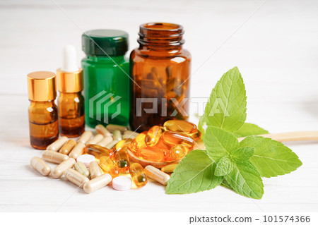 Alternative medicine herbal organic capsule with vitamin E omega 3 fish oil, mineral, drug with herbs leaf natural supplements for healthy good life. 101574366