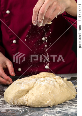 Professional cook makes yeast dough Professional cook makes yeast dough 101575871