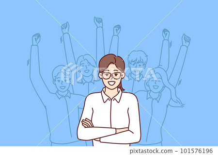 Woman leader standing with arms crossed near team located behind and making victorious wave of hands 101576196