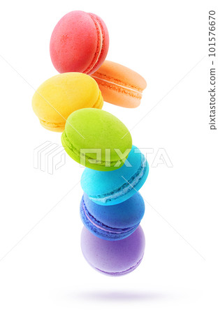 Rainbow coloured macaroons levitation. Vertical shot isolated on white background 101576670