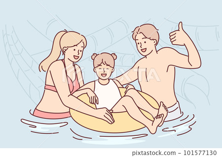 Happy family posing swimming in hotel pool during summer vacation or traveling to tropical island 101577130