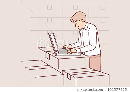 Man with laptop works in warehouse, standing near boxes, auditing availability of goods in storage 101577215