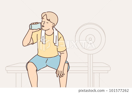 Man is in fitness club and drinks protein shake from shaker to restore carbohydrate balance Man is in fitness club and drinks protein shake from shaker to restore carbohydrate balance 101577262