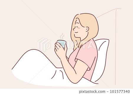 Woman is drinking coffee sitting in bed under blanket enjoying morning weekend and good mood Woman is drinking coffee sitting in bed under blanket enjoying morning weekend and good mood 101577340