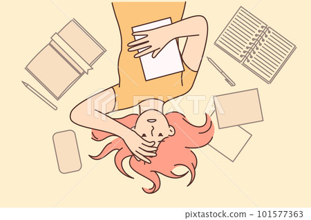 Woman student worry about upcoming exams at university or college lying on floor among textbooks Woman student worry about upcoming exams at university or college lying on floor among textbooks 101577363