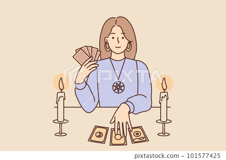 Woman with Tarot cards in form of witch sits at table and predicts future being fortune teller Woman with Tarot cards in form of witch sits at table and predicts future being fortune teller 101577425