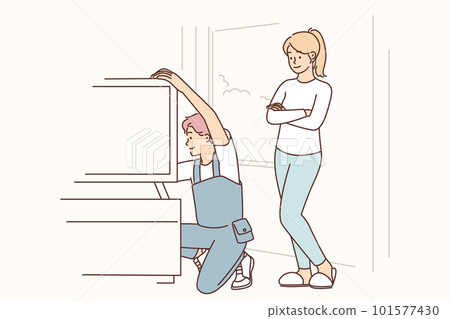 Engineer is repairing television in home of female client who called wizard to help install new TV 101577430