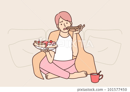 Sad woman eats lot of sweet high-calorie food wanting to get rid of stress after failed relationship 101577450